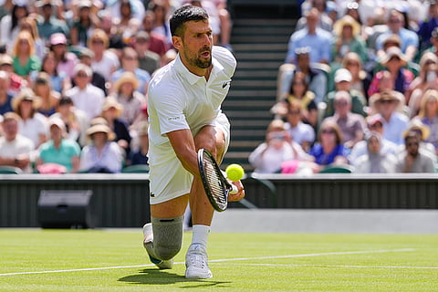 Djokovic plays a forehand return to Jacob Fearnley 